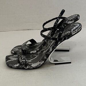 Jefferey Campbell sandals with metallic sculptural heel and a snakeskin upper 9